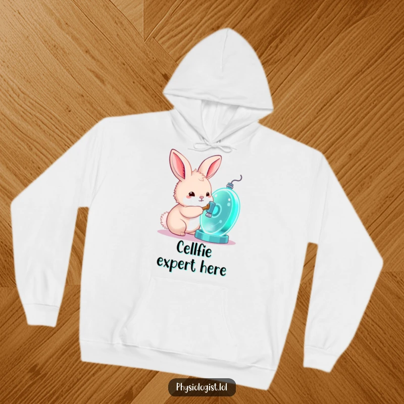 Funny bunny hoodie, a cozy sweatshirt featuring a curious bunny tapping a glowing cell model with a hammer, for science lovers.
