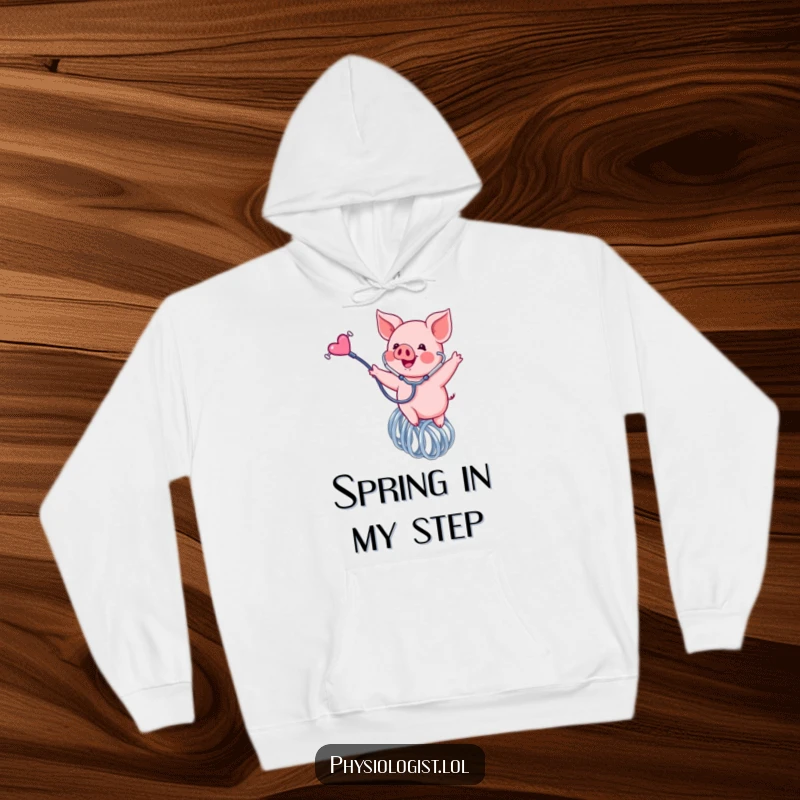 Funny piglet hoodie, a cozy sweatshirt featuring a happy pink piglet bouncing on a spring with a stethoscope, full of joy.