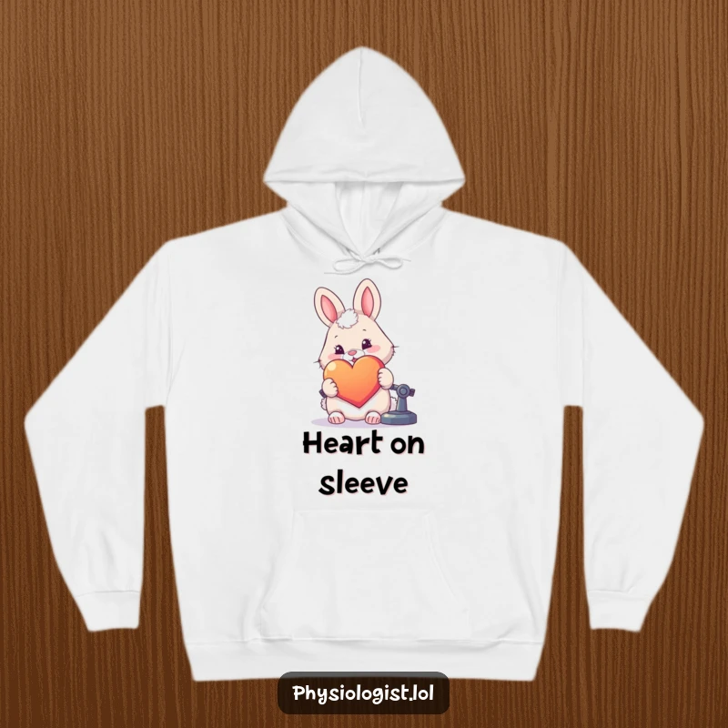 Funny, cozy hoodie featuring a fluffy rabbit examining a large, colorful heart under a microscope.