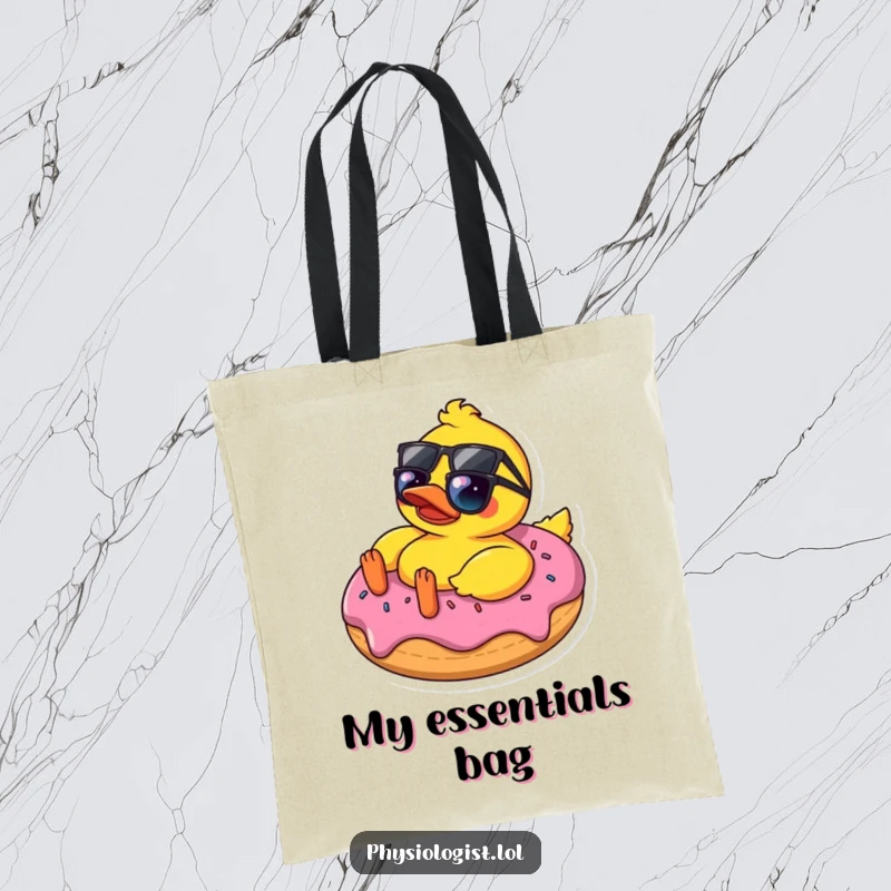 Funny rubber ducky with sunglasses chilling on a donut, printed on a tote bag, showcasing a humorous and carefree vibe.